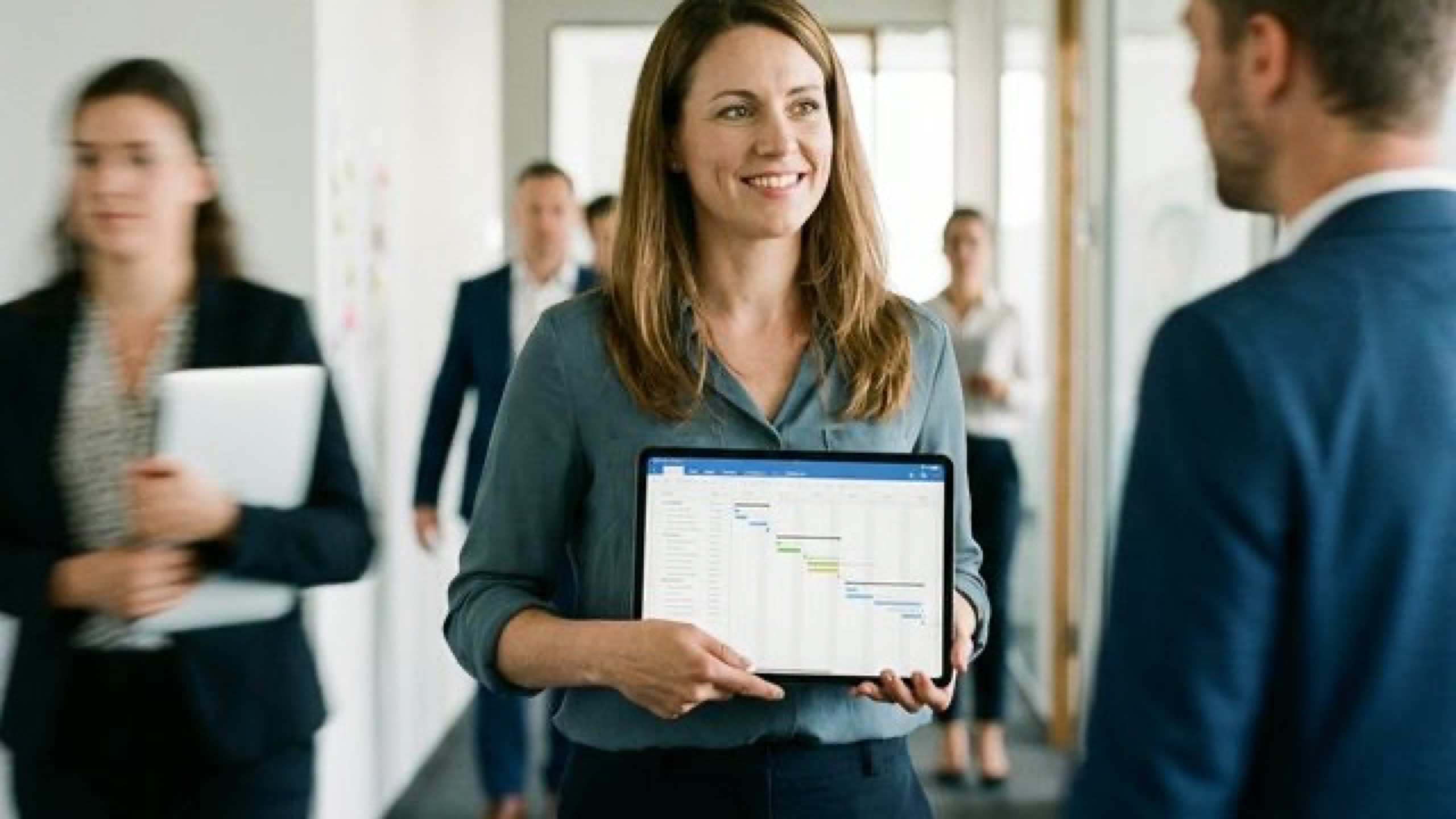 Project manager reviewing a delivery timeline on a tablet